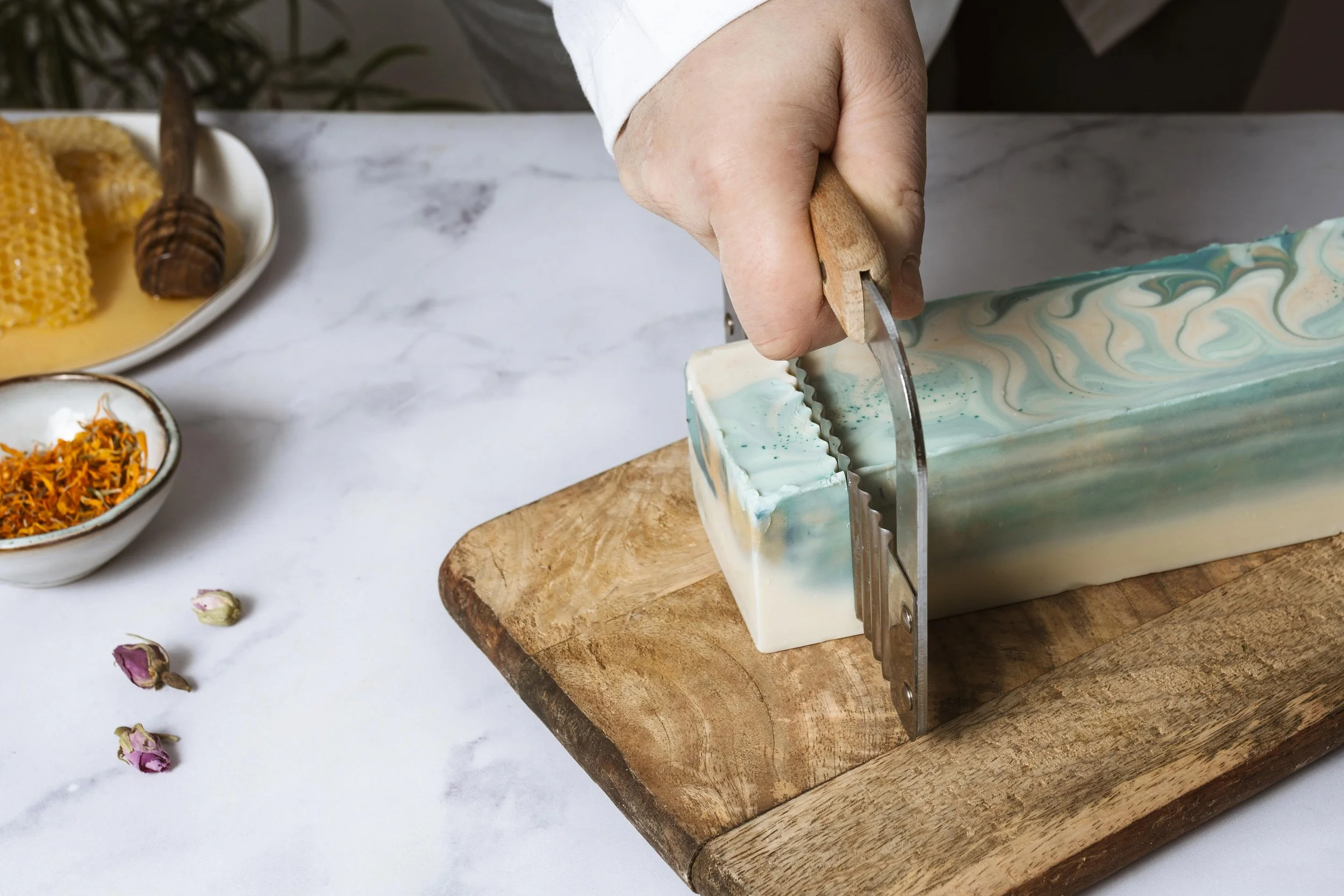 close-up-hand-cutting-homemade-soap.jpg