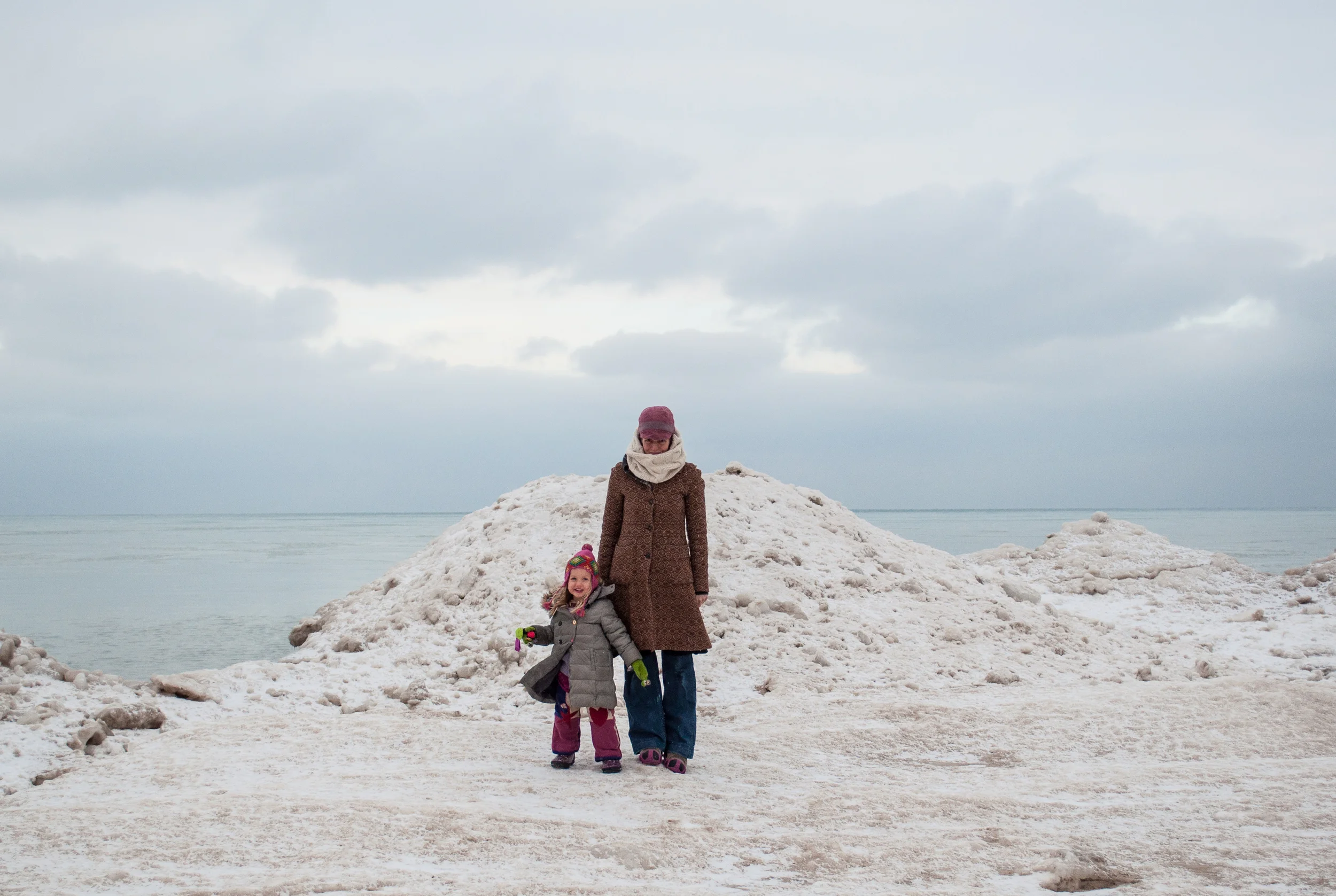  Every year I eagerly await the arrival of our local urban tundra. Chicagoland may not exactly be the Arctic circle, but sometimes it resembles such vast, flat, frozen land. At the height of winter one can sometimes find twenty foot tall ice walls, temporary caves and icebergs along our lakefront. This is my eighth winter here and each year is different. Last year there was little sign of the beloved temporary glaciers as our winter temperatures never stayed below freezing for long. Given that we are steadily warming our planet, to devastating effect on a large scale, I feared our scenes of winter might never return. But this year, while the warmest winter on record for so many areas of the world, was full-fledge, old-school winter here in the mid-western United States. We had four days where the temperatures plummeted to fifteen degrees below zero and almost three months where we never broke freezing. That said, this was an epic year for our urban tundra.