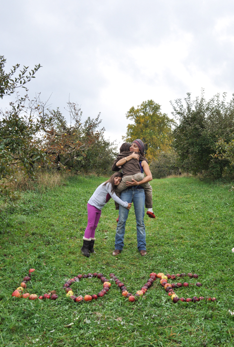 During an Autumn visit to Tryon Farm, a sustainable collective farm community in Indiana, my six year old daughter and her best friend were talking about their American Girl dolls (a brand that had its heart in the right place when it began, but now just seems to promote needless consumption to little girls) and homemade computers and cellphones. Yes, homemade, out of cardboard with detailed hand drawings of screens and keyboards, a longing for access to technology that has inundated and permeated every ounce of our culture. And their conversation was killing me, listening to this prattle about stuff, longing to have more junk to clutter up their lives, craving computers and phones because this is what they see around them. They see other kids with mountains of toys, they see adults always on computers or people picking up their phones constantly to communicate or check on this or that. They want to be a part of the action too. Even though they are not kids with an excessive glut of belongings, even though they deeply value and cultivate intimate relationships with dolls they have spun identities and adventures for, even though they were innovative enough to make their own versions of what adults have and pretend to use said things, I needed the conversation to shift deeply and so we had to stop, to inhale into our surroundings, to be quiet, to listen and then sink deeply into our experience of the there and then, without straying back into our world beyond that moment. I needed all of us to have the chance to be present where we were at that very moment because it is such a unique and rare opportunity when you live in the rhythm of the urban globalized world to connect to nature. And so I enforced a rule, just for those two hours while we walked, that they had to open their eyes to where they were, that they were not allowed to talk about any brand or thing that they wanted, that they were not allowed to talk about phones or computers, but instead see what was around them, explore their immediate surroundings, gather leaves, find something to collect, ignite a little of the magic that is in the dirt at our feet. The rest of the walk, was, well, pretty darn fabulous. There was silence and wonder and curiosity and collecting of acorns and little berries and discussions of building things and awe at nests we saw, and a deep listening to the sounds of animal rustles and tumult in the thicket. It was magic that planted a seed of reminder, planted a memory to come back to, a space of understanding that this is the land we come from and man oh man do we want it to be here for us, to feed us when we are hungry. 
