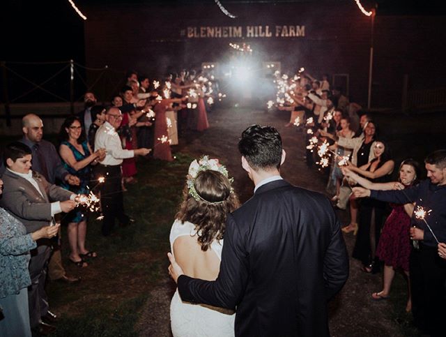 A magical sparkler sendoff in front of the red barn!