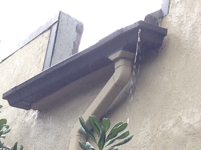 This setup has been in place for many years. Without this inspection, we wouldn't have known that the downspout was leaking from the end. We might check to see if the gutter is full of leaves. If this clears the problem, great! But it also looks like the end of the gutter is sagging, so it may need to be repaired.