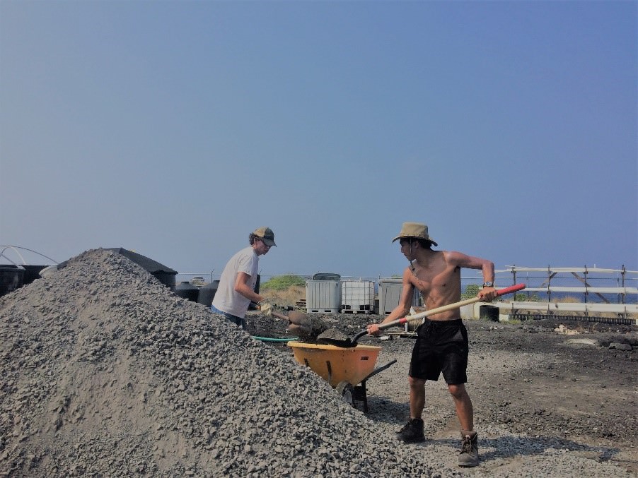  C.J. and Travis helping spread 20 tons of gravel for tank platforms.  