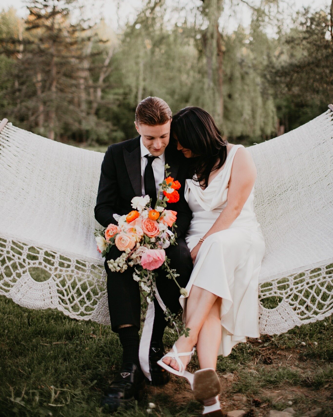 Who doesn't love a good hammock?
@thewoodhouselodge 
.
.
.
.
.
.

#WoodhouseLodgeWedding #SpringWeddingPhotography #ColorfulBouquetLove #HammockWeddingMoments #PNWSpringWedding #BayAreaVibrantWeddings #HudsonValleyWeddingPhotographer #ElegantWoodhous