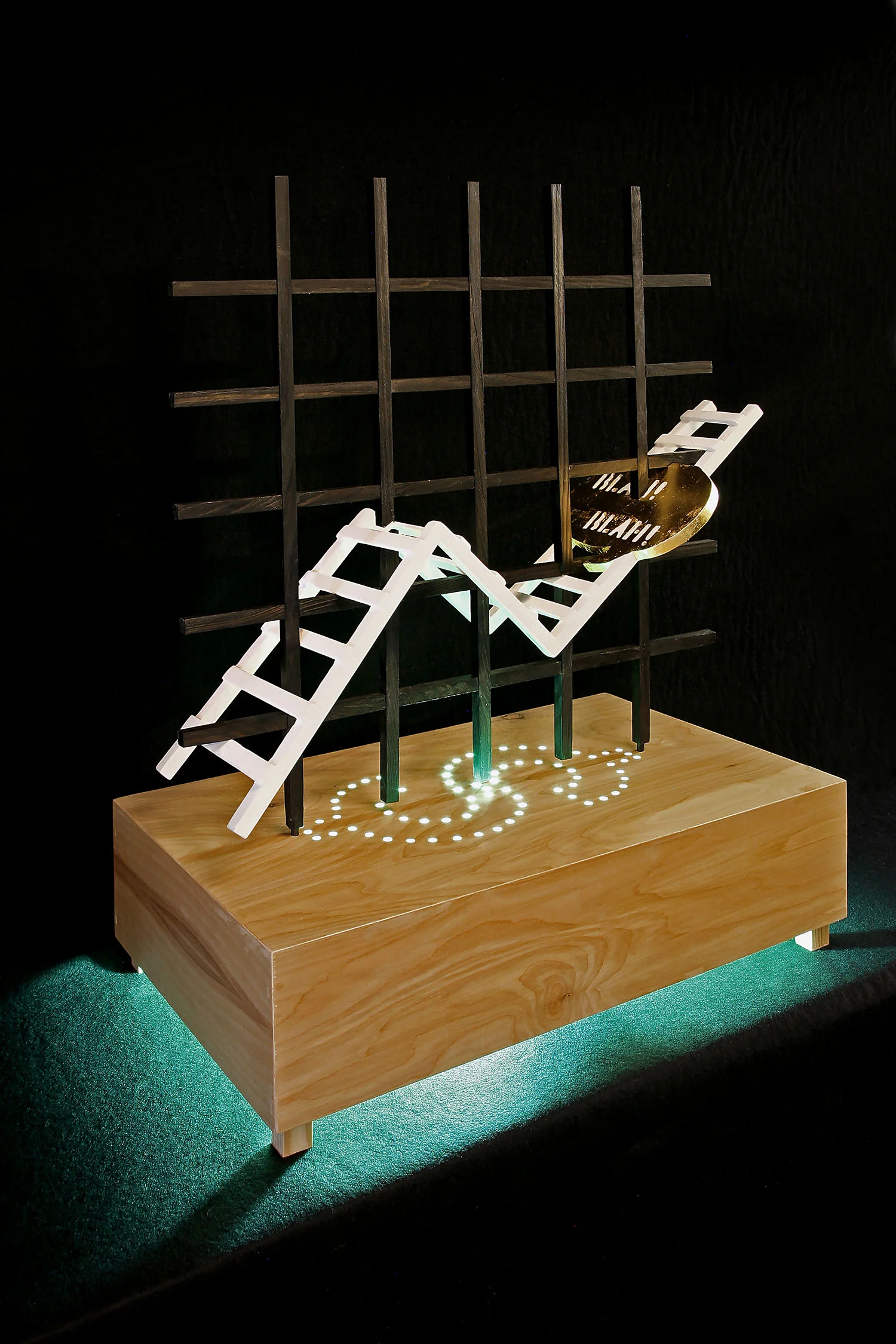 "Ladder Of Success", 26" h x 24" w x 16" d; wood, gold leaf, paint, plexi rod, LED lights, steel; © Tom Gormally 2017
