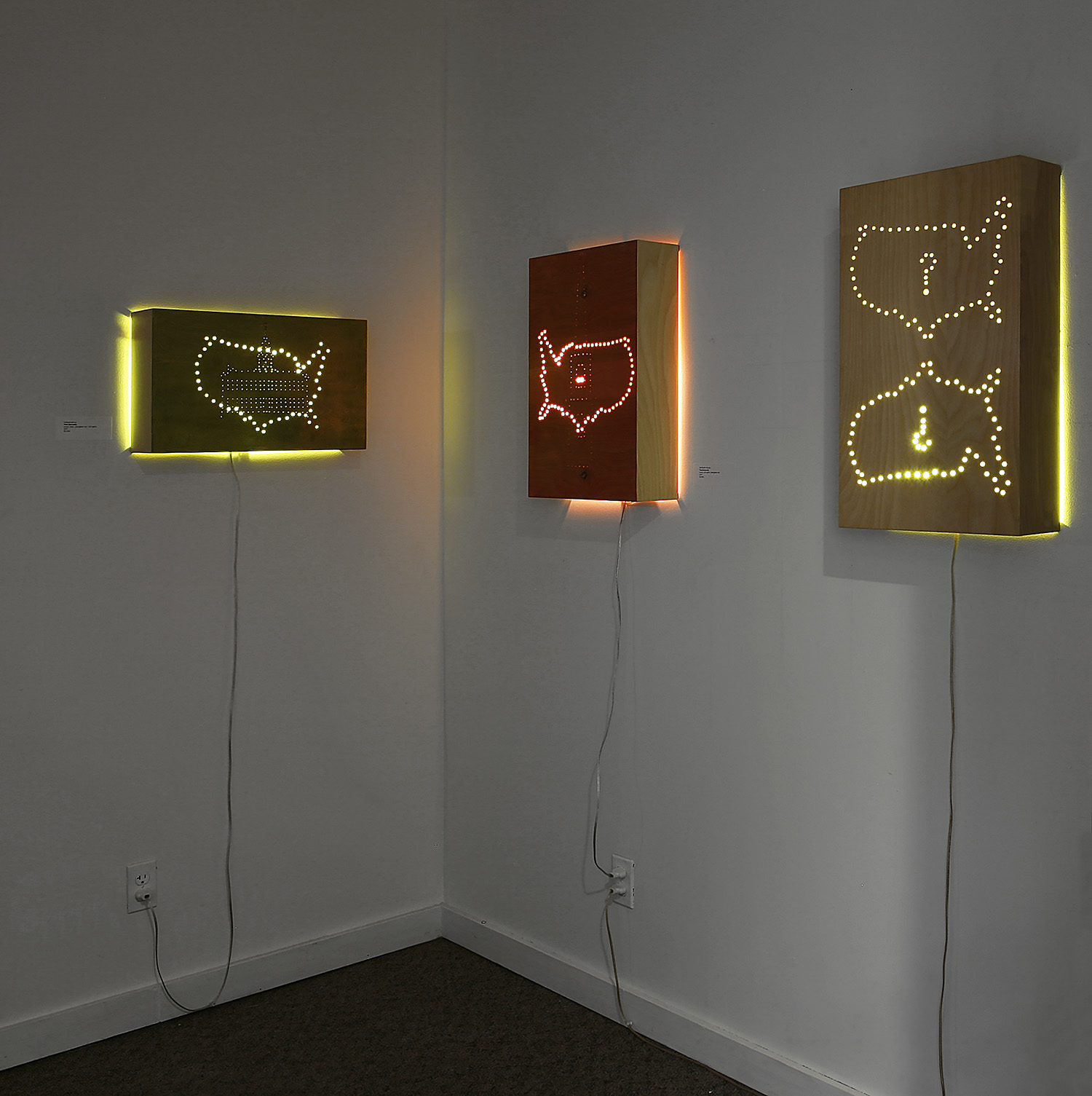 "Patriot Series" installation, dimensions variable; wood, gold leaf, wood dye, plexi rod, LED lights; © Tom Gormally 2017