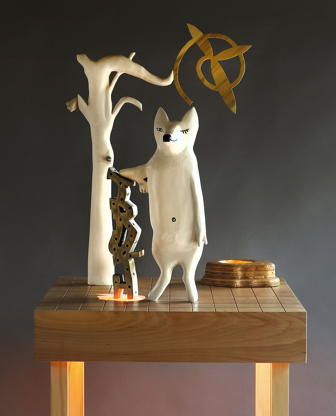 "Fox Leaning on the Truth", 70" h x 24" w x 20" d; wood, plexiglass, gold leaf, acrylic paint LED lights; © Tom Gormally 2019