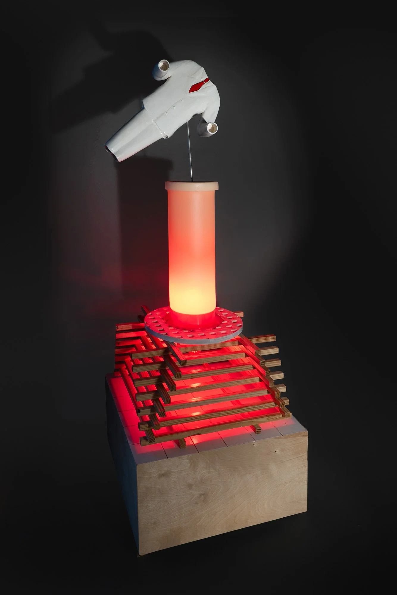 "Empty Suit", 2026. Wood, paint, LED light, plastic labware.  24” x 24” x 65”  Photo: Mark Woods