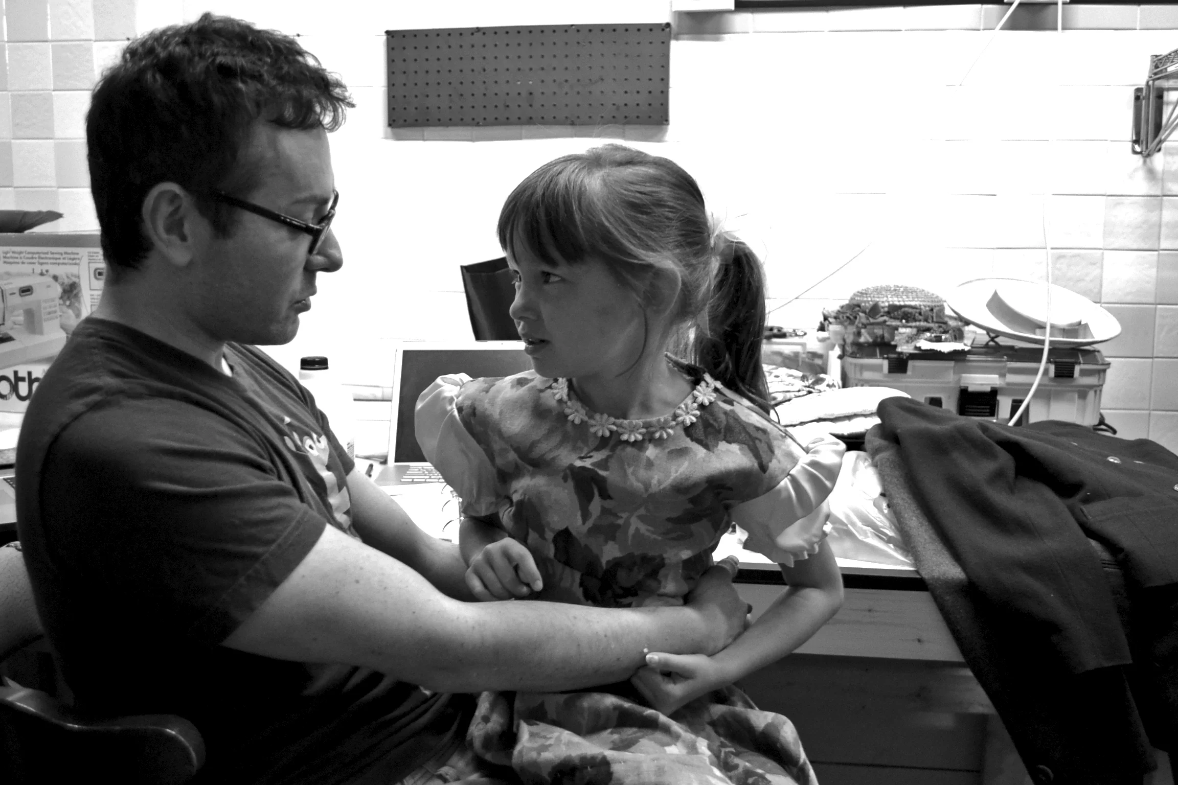 Director Joel Froomkin confers with Gabriella Betterly (Gretl von Trapp) during costume fittings.