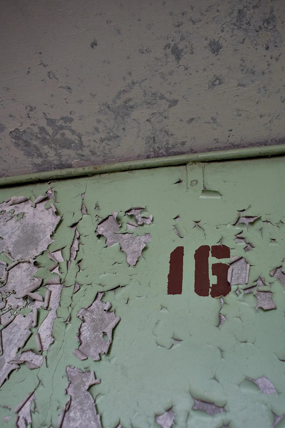 16th floor stencilled sign.