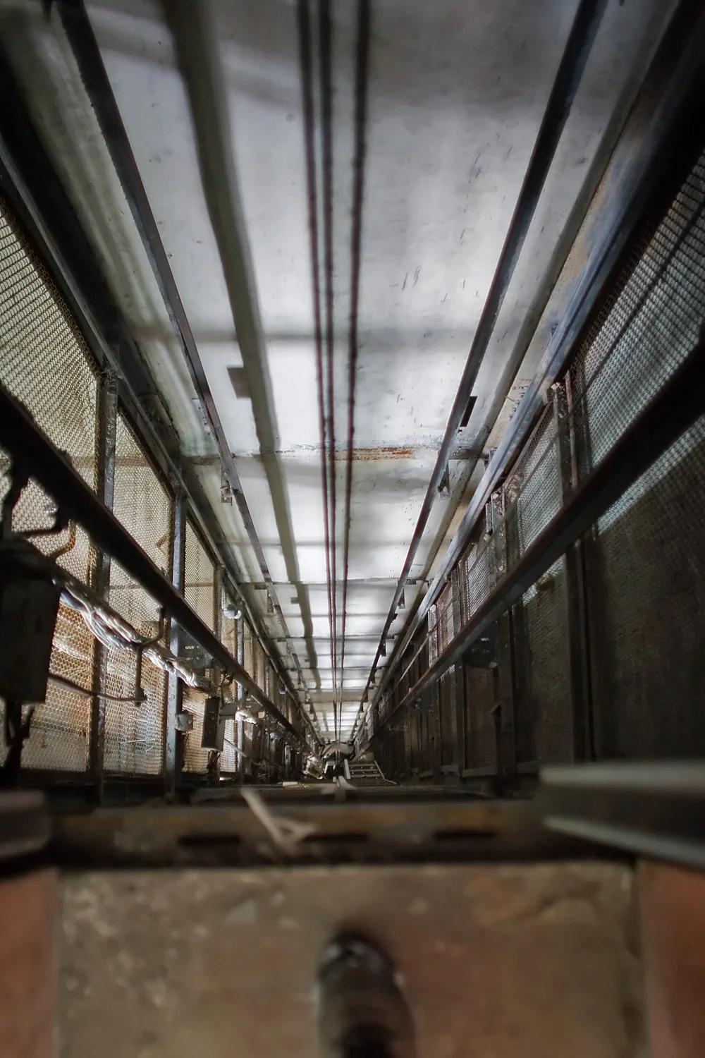 Looking down the elevator shaft from the top floor.
