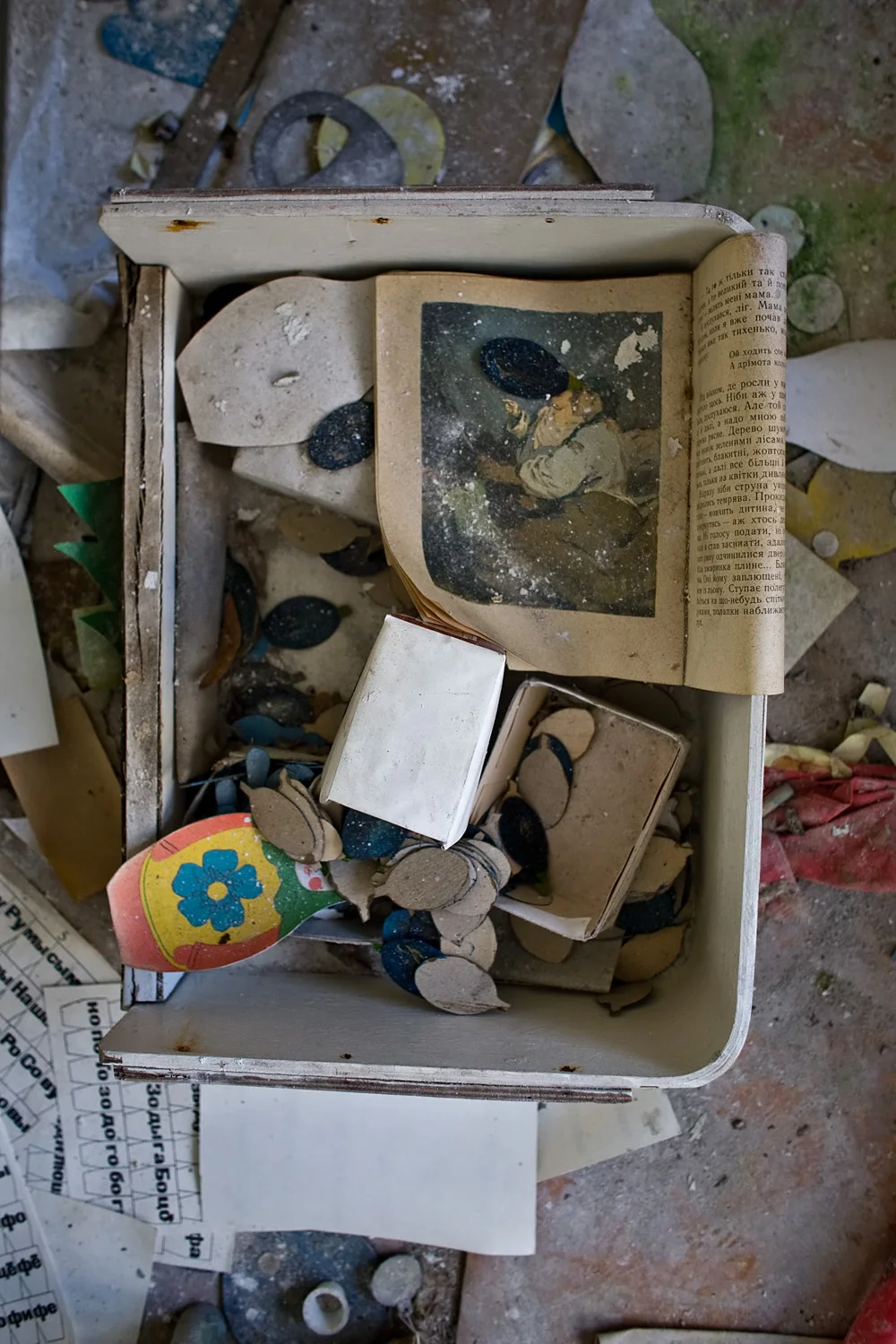 Box/drawer with book and toys.