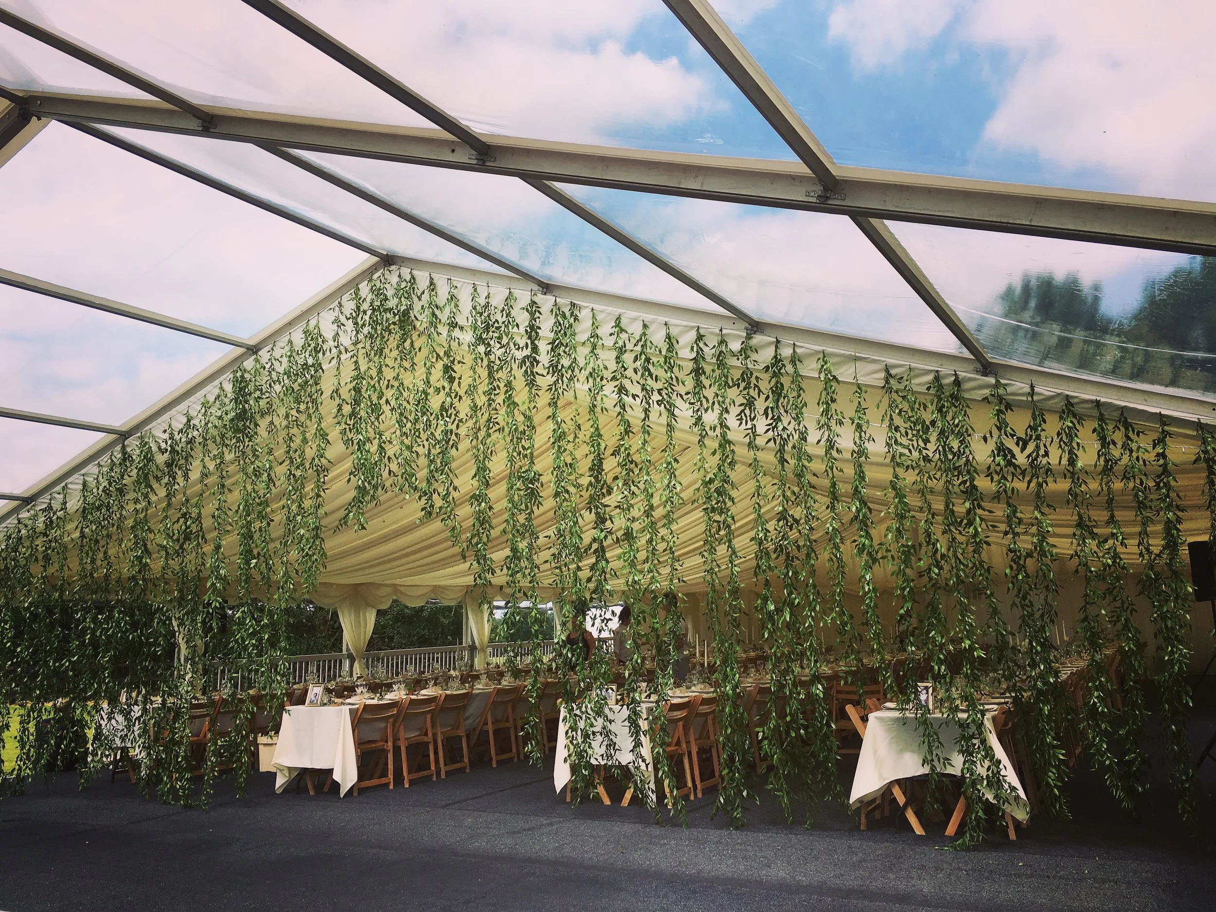 The all foliage curtain creating an effective divide between eating and dancing but also being a real talking point for your guests