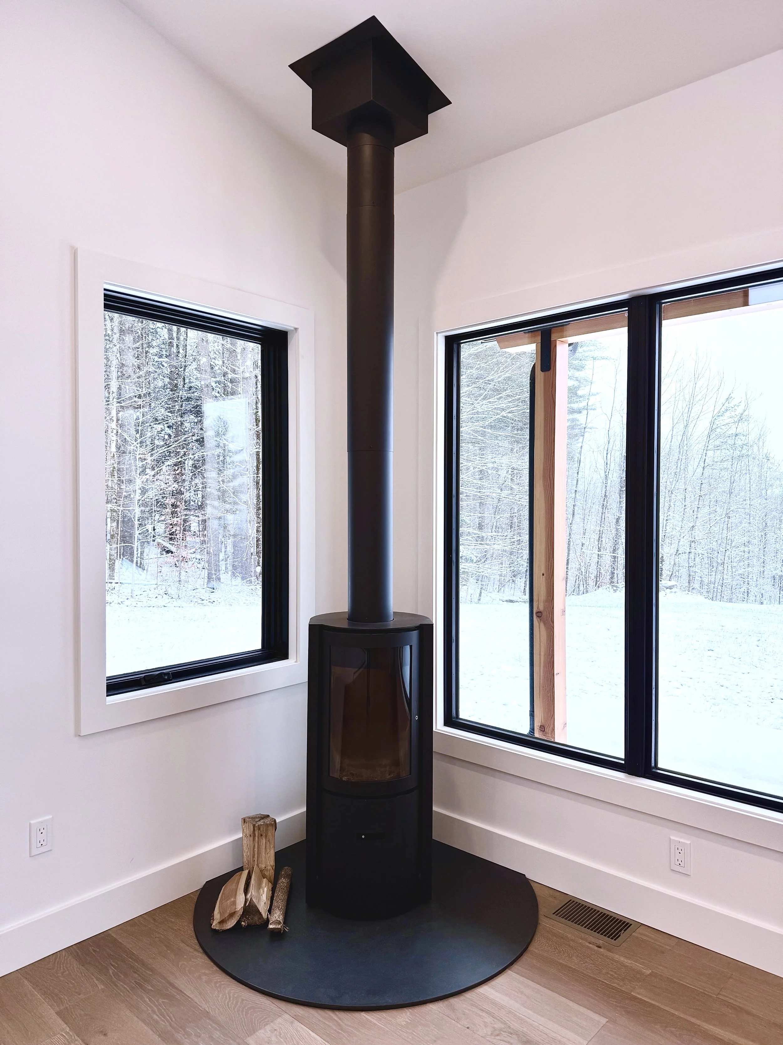 Stuv fireplace with a view. Vermont pro construction.jpg