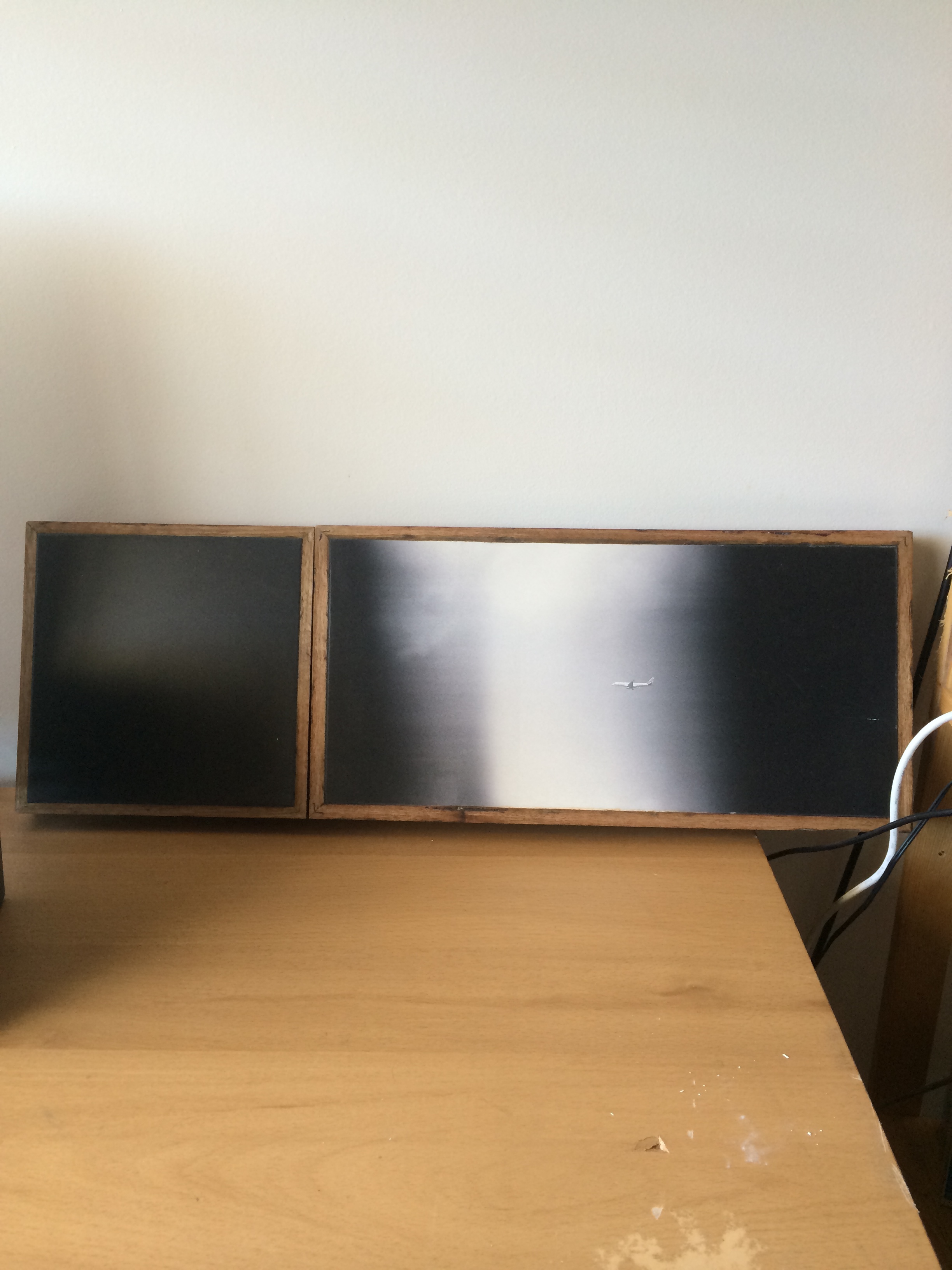 Pictured here on my desk in my room. 2 frames, the left having a slight speck / scratch from the original film frame (probably when it was scanned) and the right frame being of a Virgin Airbus. If you look close enough, you can see the logo.