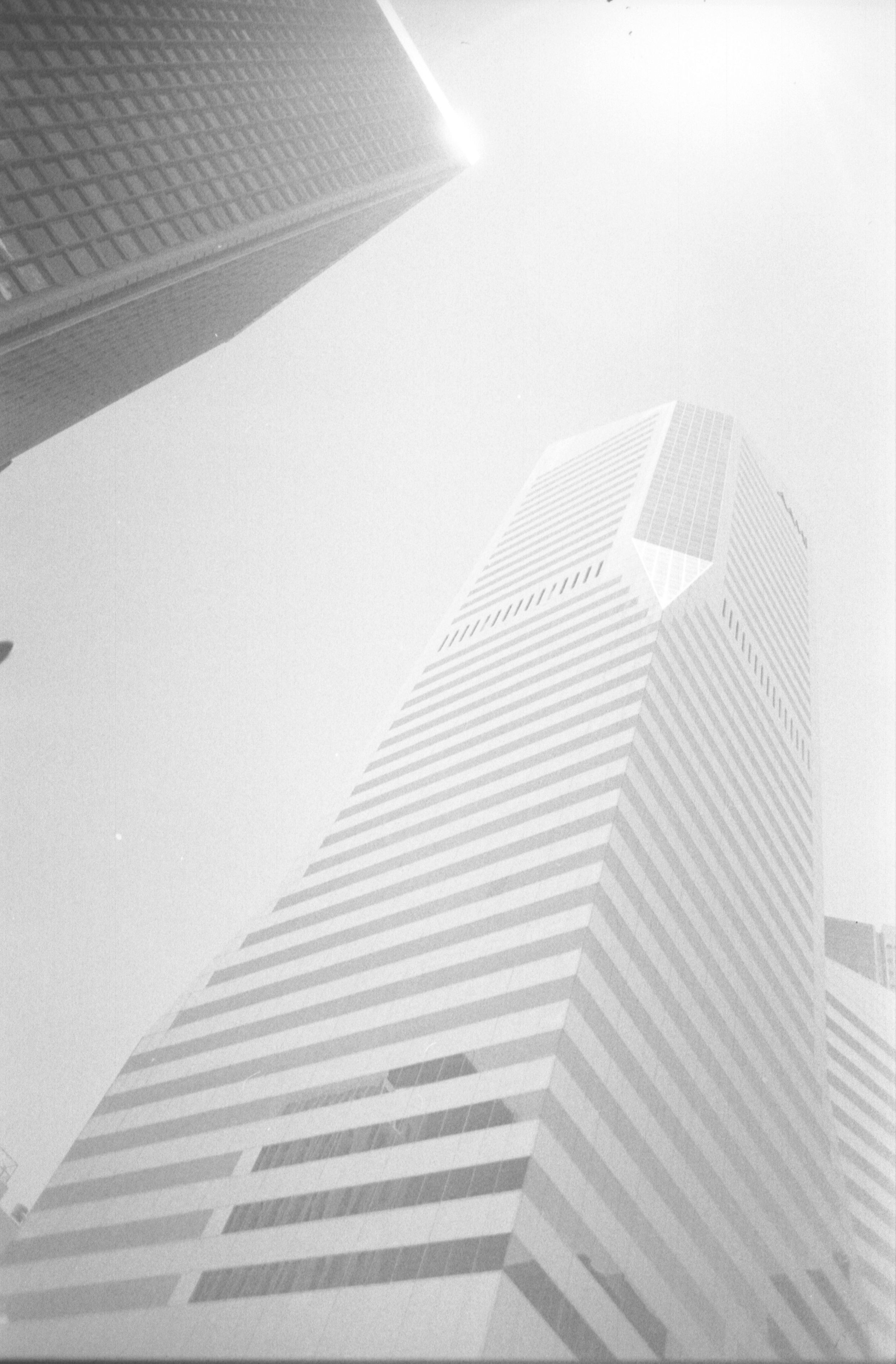 SunBeam Towers. Brisbane CBD. 28mm Sigma FD Lens. Post edit done in such a way to maintain the bright sun shine in great. A hint of light atop the left top corner building. Each with their own dominating presence. My background in multimedia/ IT, blending digital and analogue techniques is something that comes natural. After scanning, applying curve / level adjustments to fine tune the image. Scanning doesn't always produce a favourable result. 