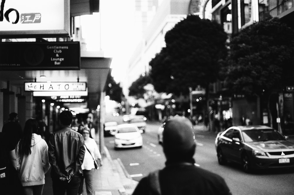 Walking along at dusk, a great time for shallow depth of field with bright lenses (f/1.4).