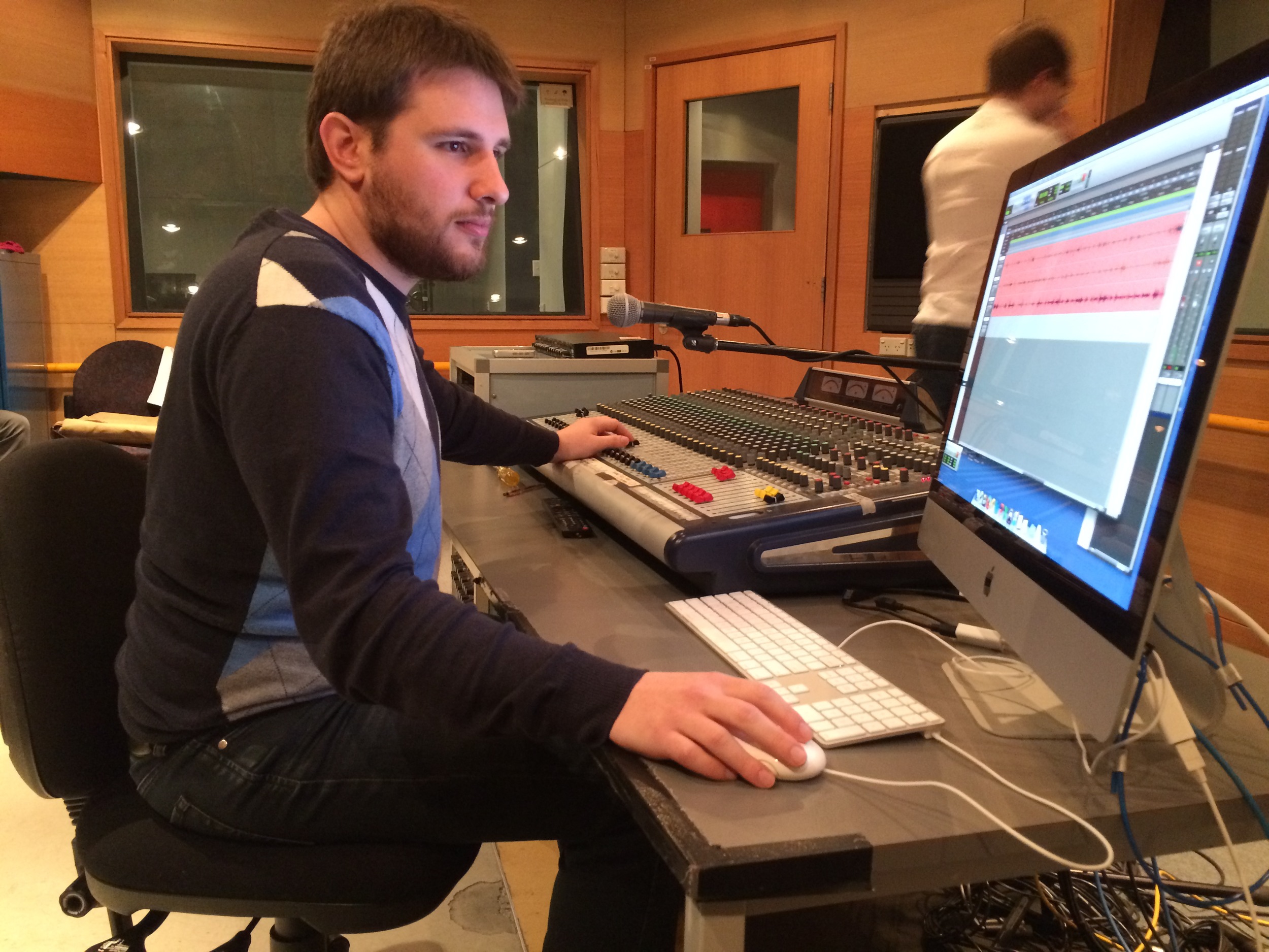 Joel Zammit, founder of Melbourne-based podcast collective Sanspants Radio , in the control room recording comedy podcast Shut Up a Second .