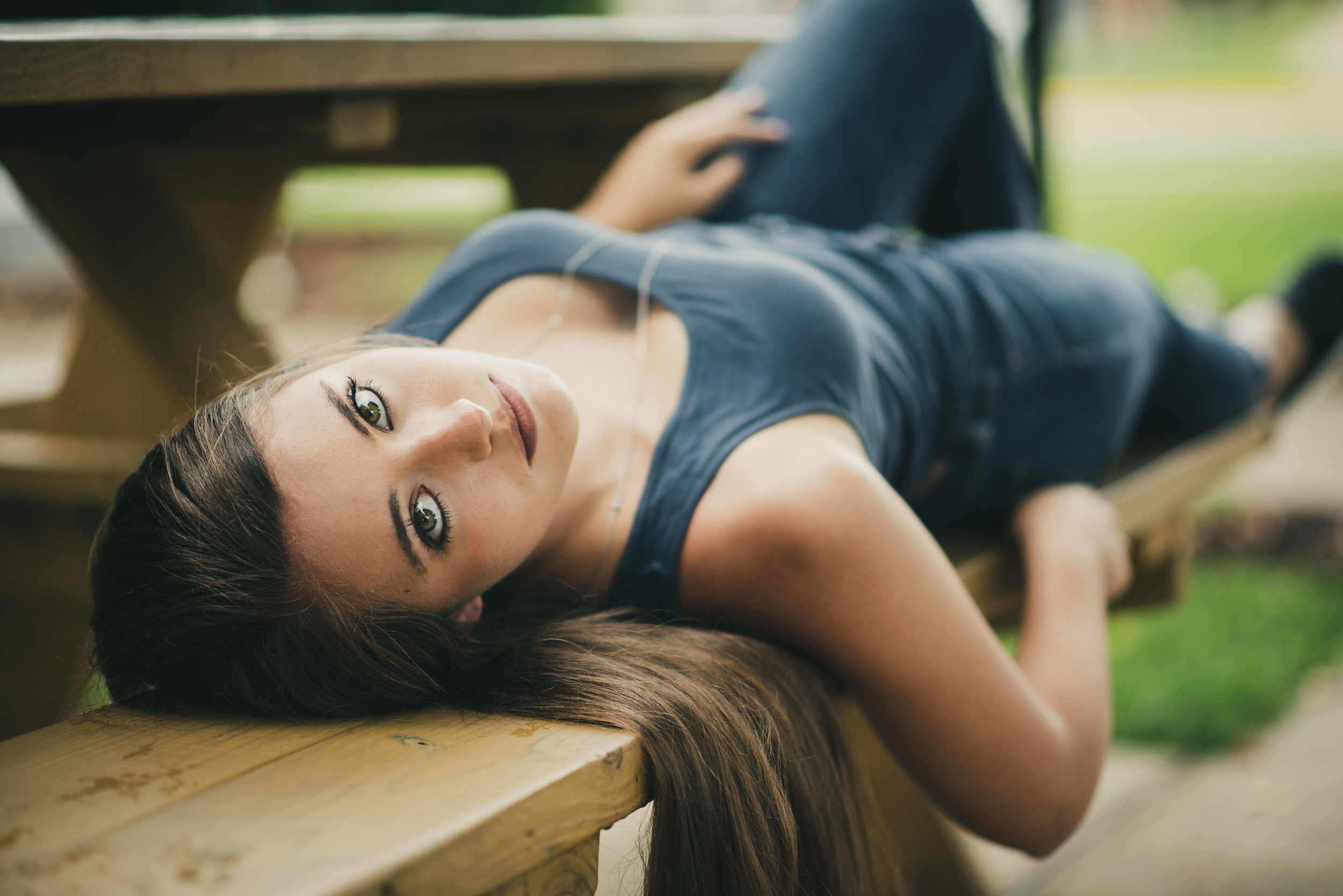 Model portrait on picnic table bench in town square of Clarion PA