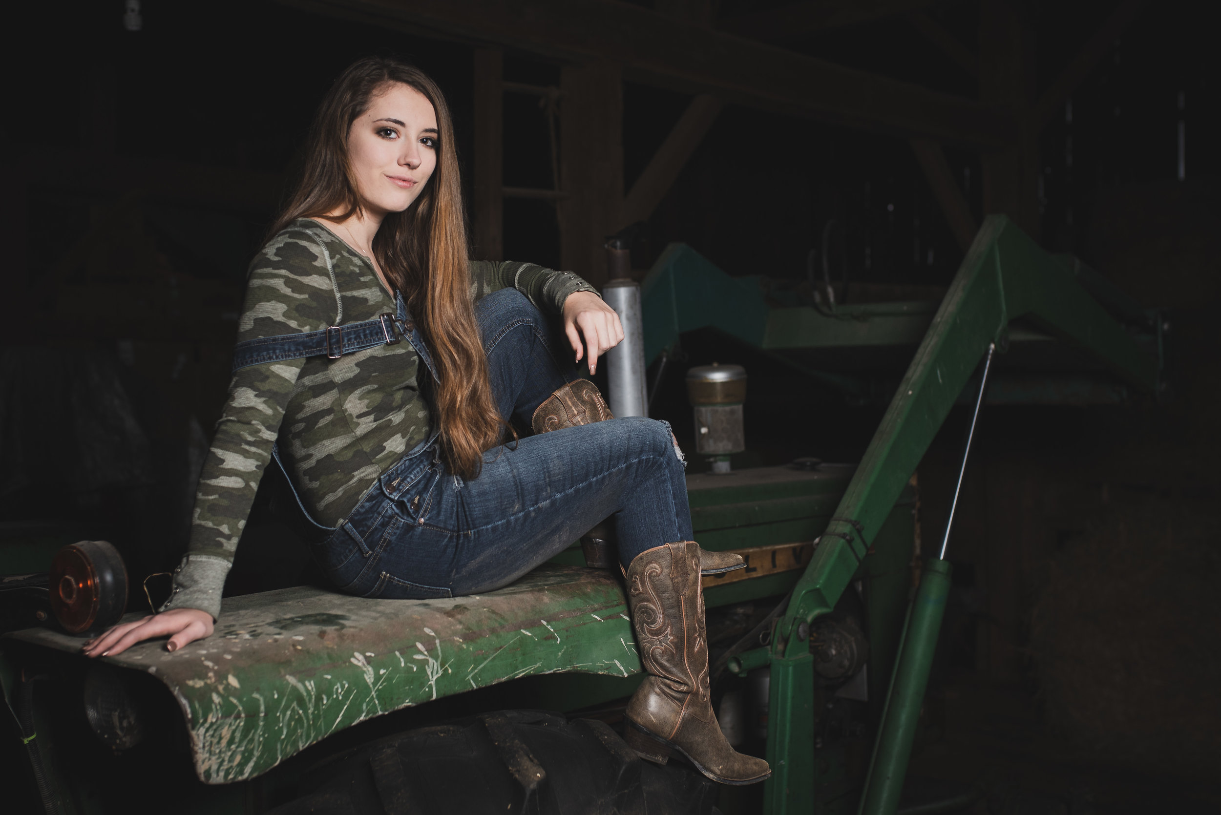 Long Haired Girl On a Tractor