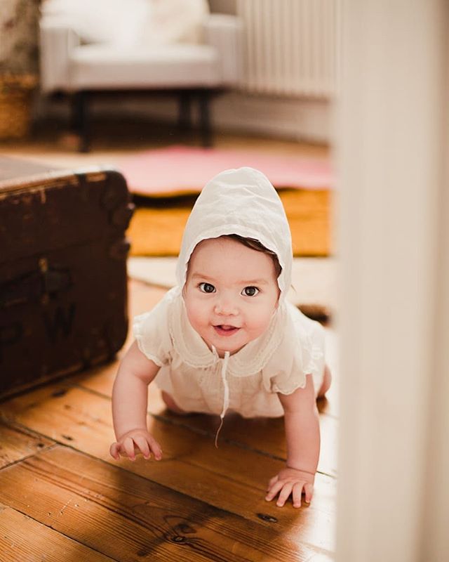 Steeling my heart, wearing the baby bonnet her Grandma put on her father 30 years or so ago.