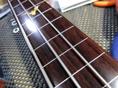 Fretless conversion with white plastic fret markers