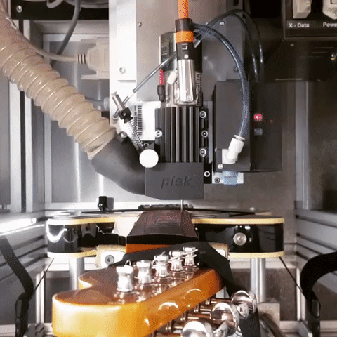 Overhead view of Plek Planing a fingerboard on a Telecaster