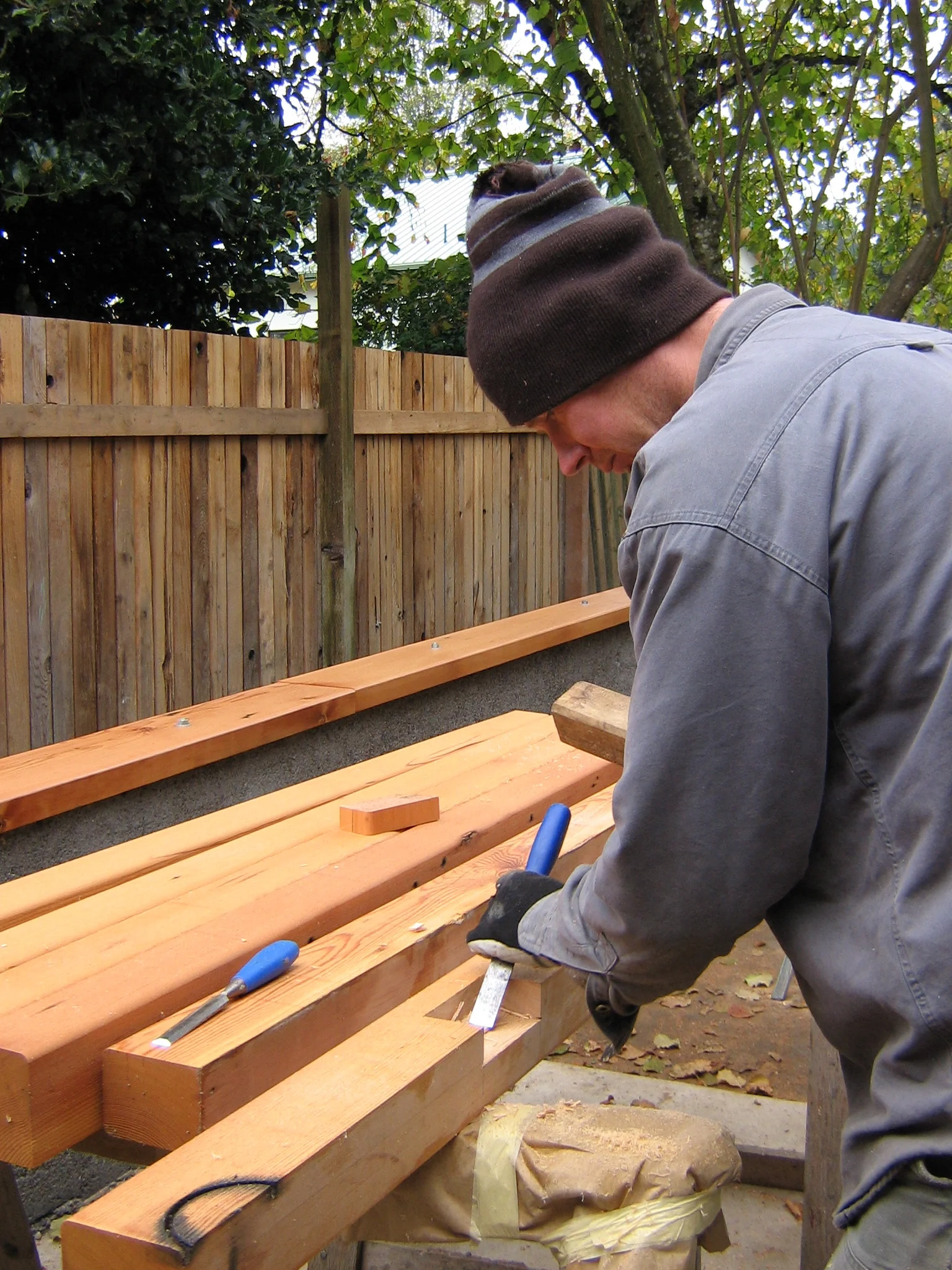Justin working on salvaged beams for the Bailey studio project