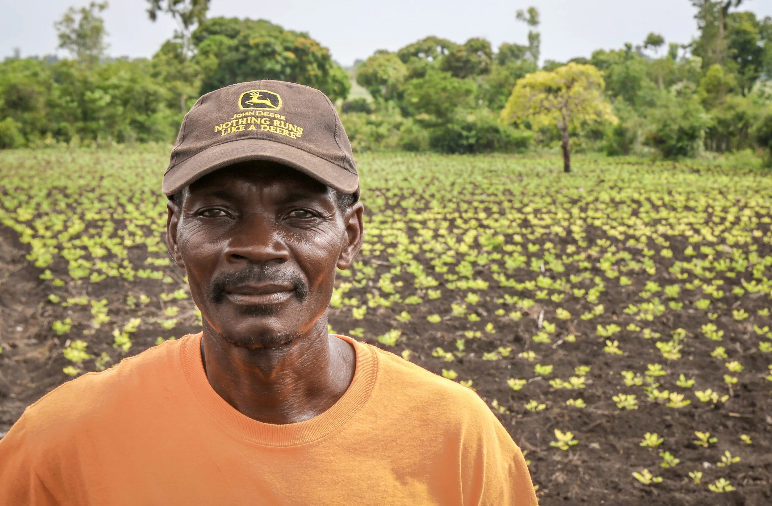 Joseph Janay, PDL farmer in front of his peanut crop in Sanyago, Haiti.