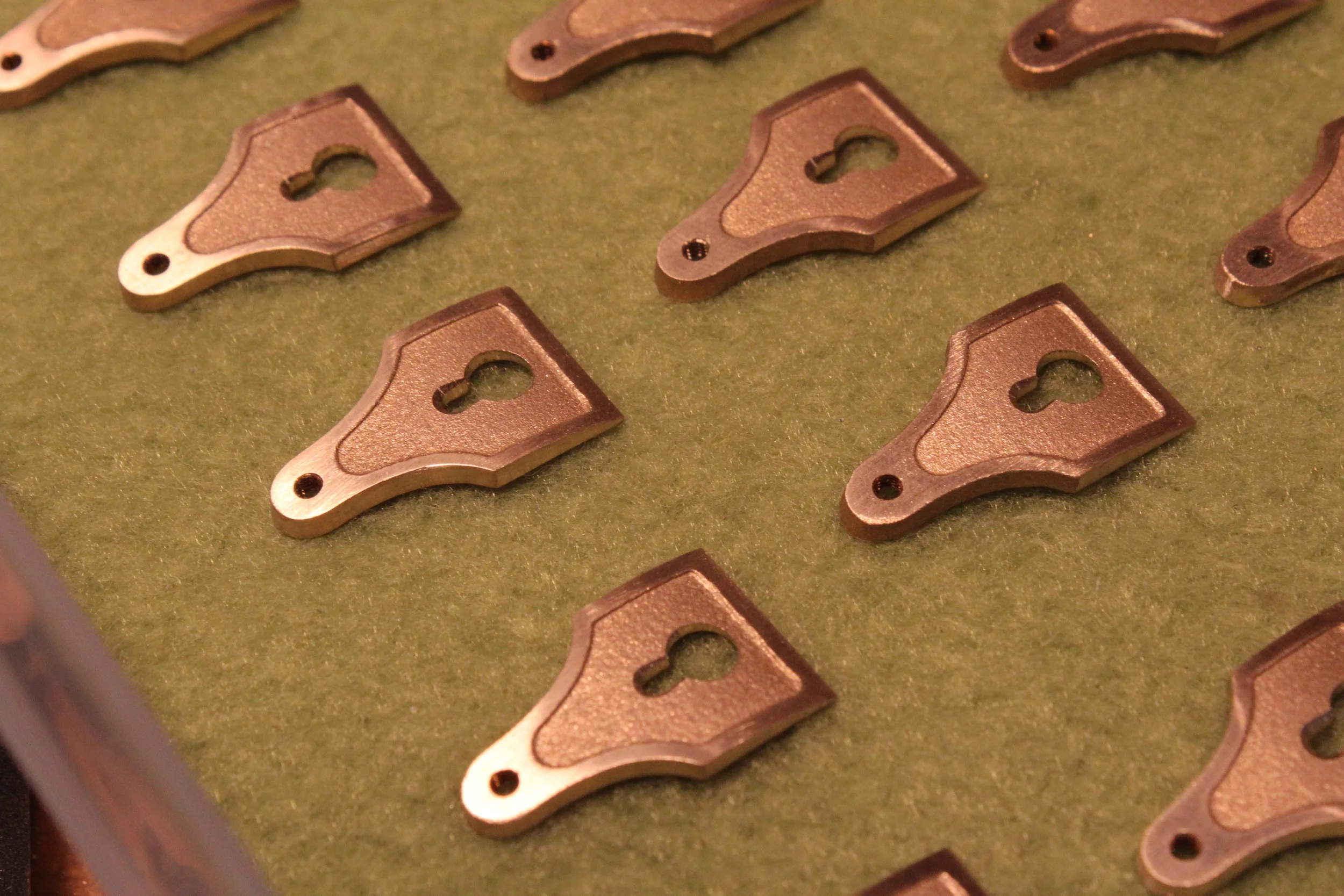 Cap irons after sanding. Waiting to be polished.