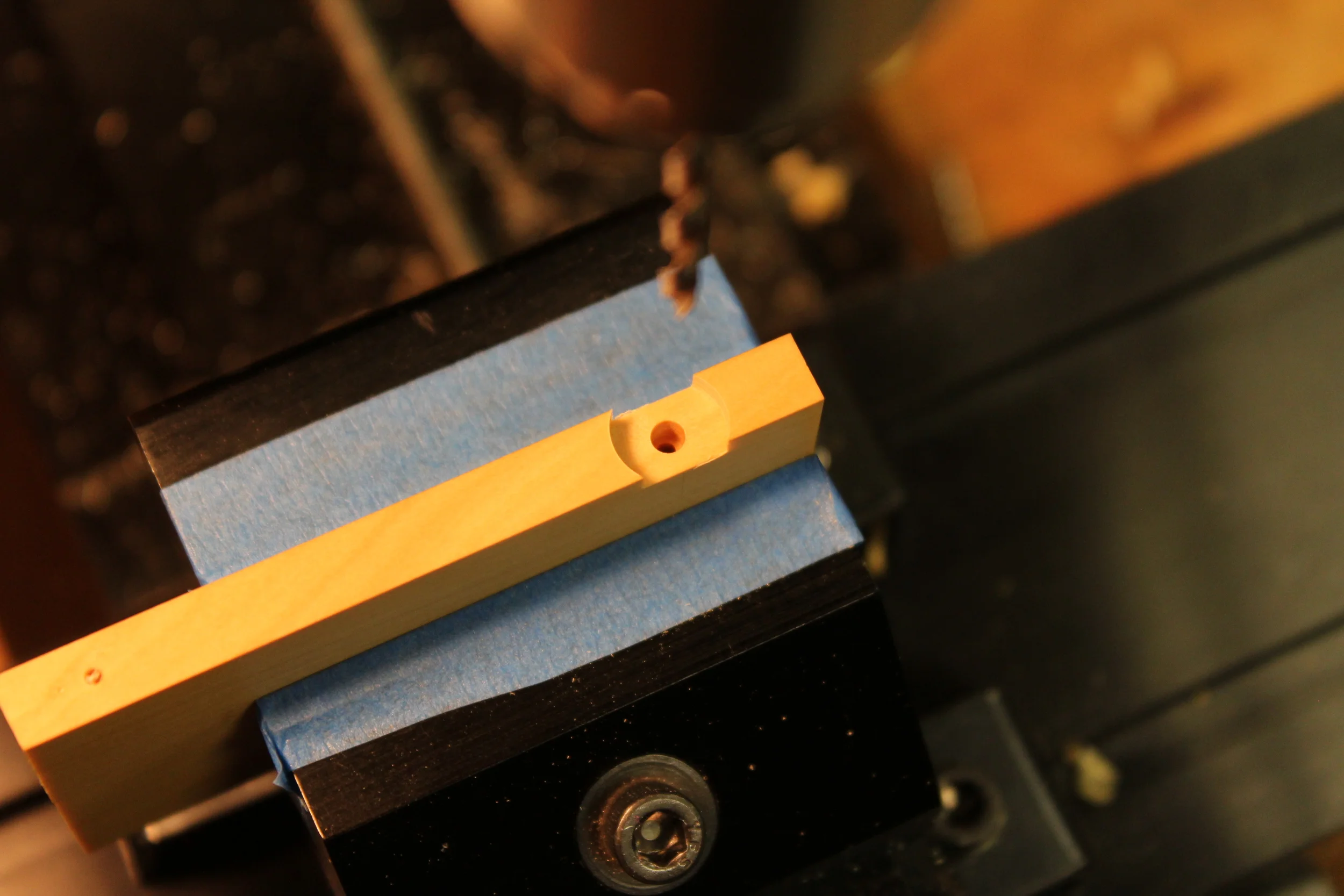 Counter bore for the brass nut on top.