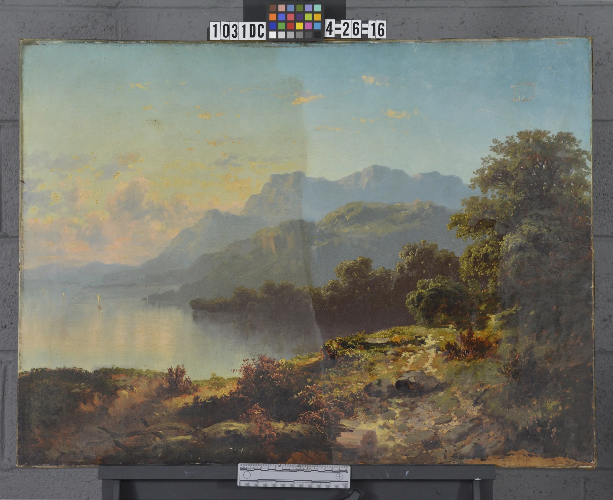 This is a photograph of the painting during cleaning. The colors are slowly being revived and the contrast is once again established, providing the original illusion of depth and atmosphere.