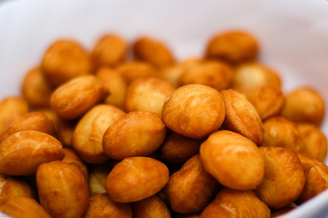Pieces of fried bread. They come in two main varieties - salty and sweet.
