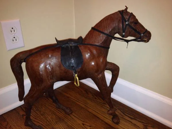 Antique Leather Horses Set of 3 $100 - I thought these were pretty unique and could be a cool decorative accessory.
