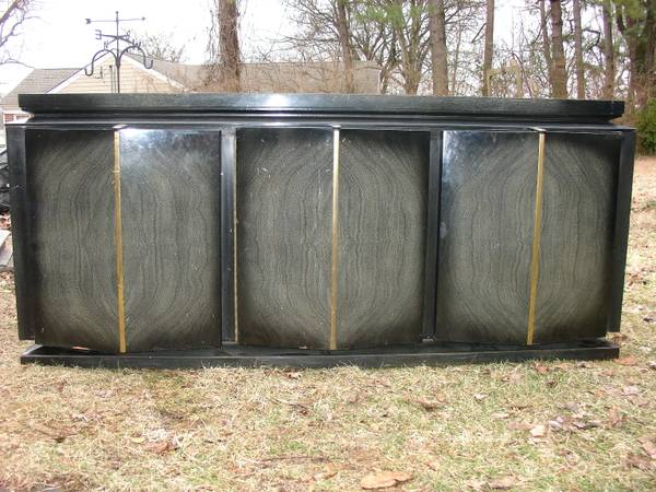 Art Deco/Modern Dresser and Nighstands $375 - I know what you are thinking, this is extremely ugly. I totally agree but I think this piece has a lot of potential. Just imagine away that terrible finish it currently has and picture a high gloss white. This piece has major potential and could look great in a modern bedroom or as a media cabinet. Trust me this could be awesome, and its been on Craigslist for awhile so if I'd were you I"d see if I could get the price down a bit. 