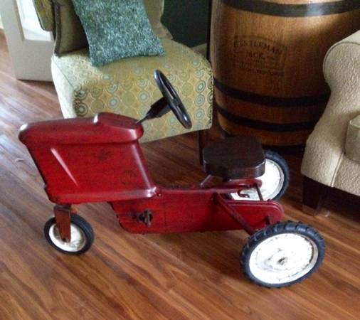Antique Peddle Tractor $65 - Could be a really cute decor piece. 