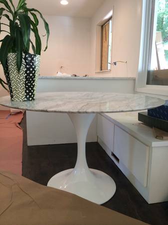 Marble Top Tulip Dining Table $800 I love this Saarinen inspired table. This particular table r etails for $1600 , and is only 2 months old. Seller is getting rid of it because it doesn't work in their new house. View on Craigslist 