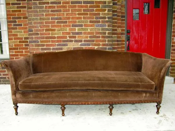 Brown Velvet Sofa $400 This is a gorgeous sofa, I love the curve of the arms and the wood legs. View on Craigslist 
