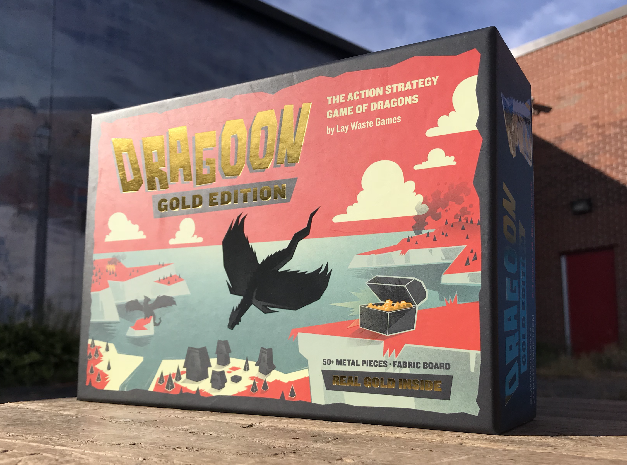 Gold Edition, complete with metal pieces, a fabric mat, and yes, real gold inside!