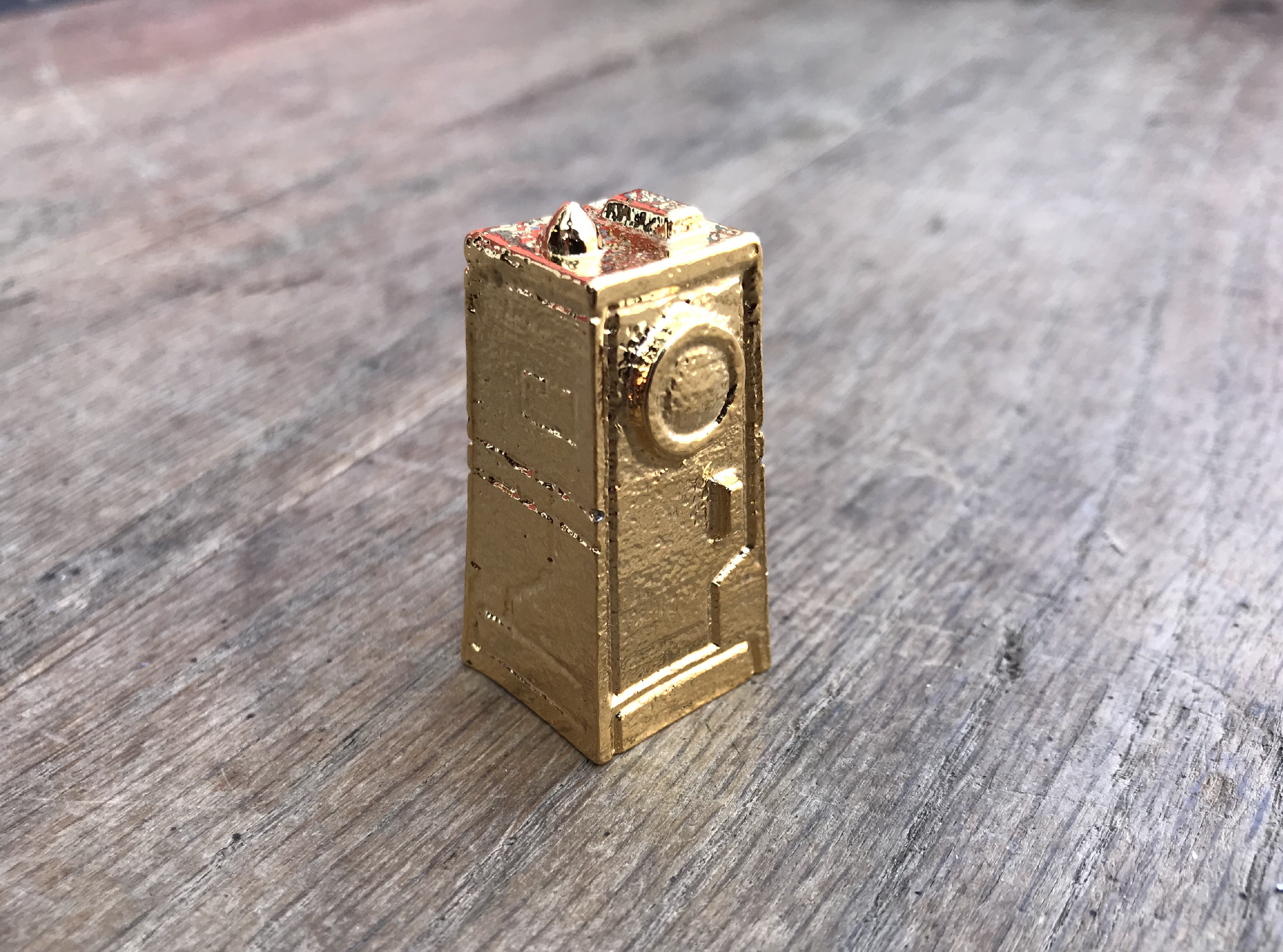 2”, finished in real gold, and used in Human Era to mark the current era. Shiny!