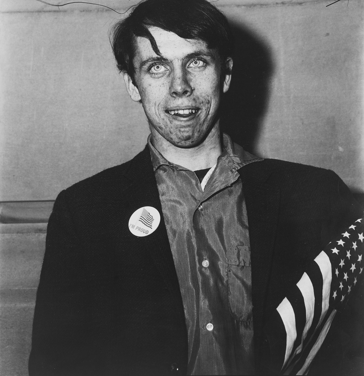 Diane Arbus, Patriotic Young Man with a Flag . NYC, 1967.