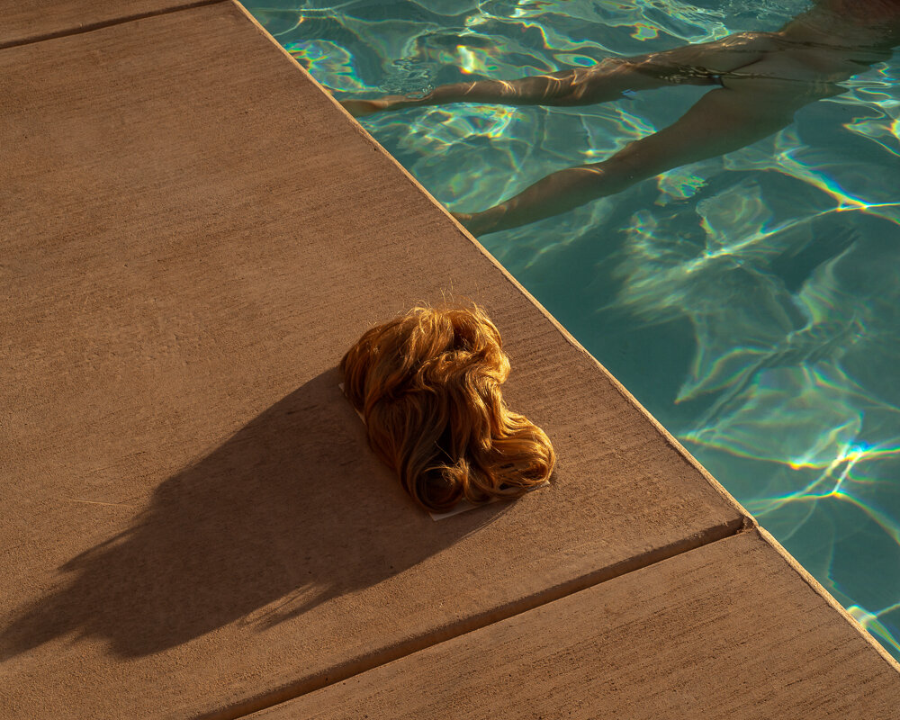 Tania Franco Klein,  Pool, Wig  (Self-portrait), from  Proceed To The Route , 2018.