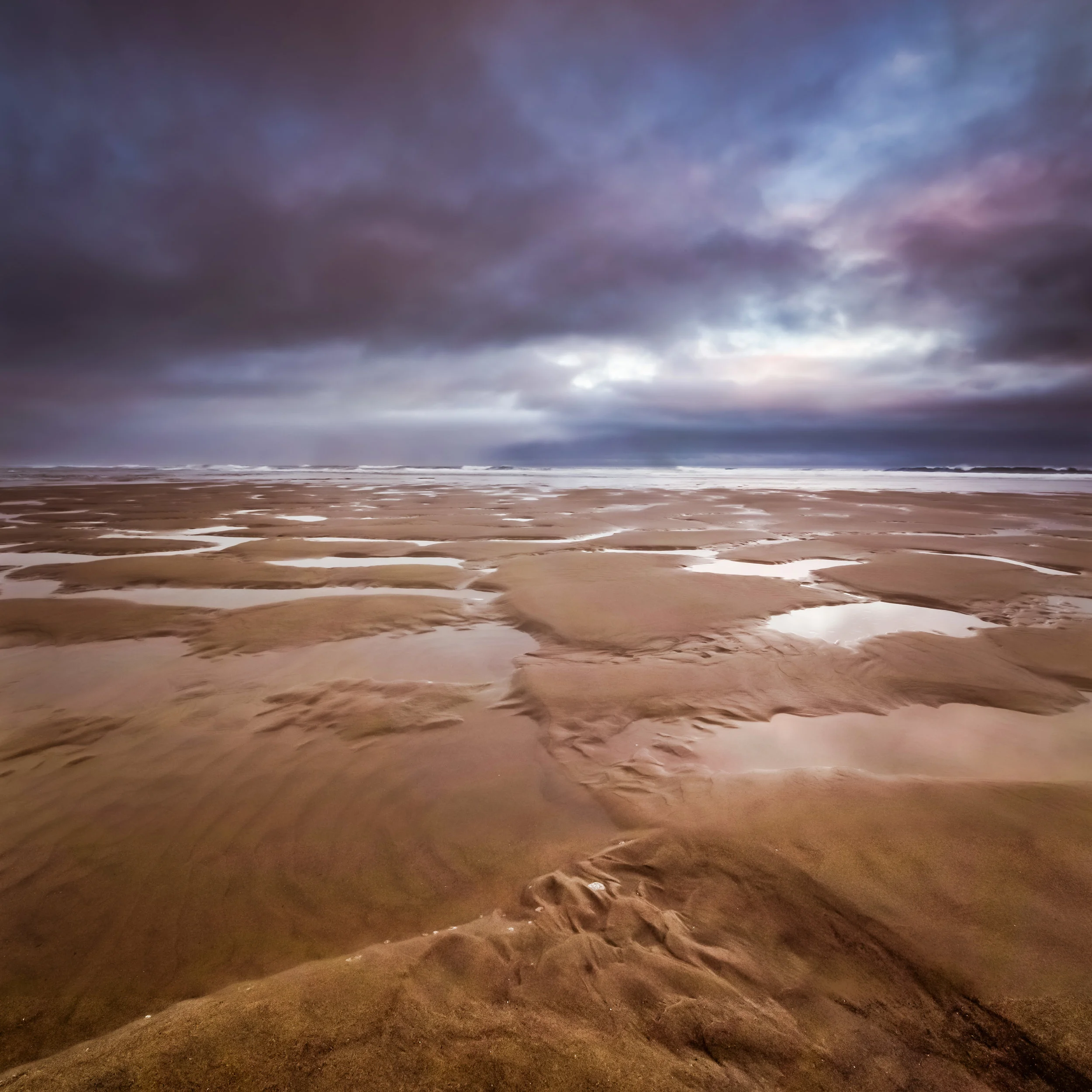 Low Tide - 12x12 print in a 16x16 mat Taken on July 6, 2015 in Lincoln City, Oregon. This photo was taken with a tilt shift lens and is actually three photos stitched together. First shown at the Denver Art Society - November 2016 First Friday.