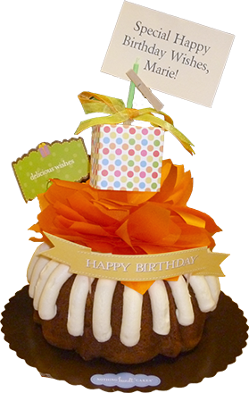 Southgate Coins owner Rusty Goe presented wife Marie Goe with a bundt cake in honor of her birthday at the Reno coin shop