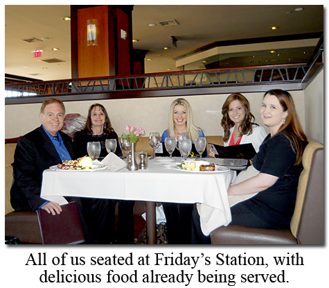 Seated at Friday's Station dinner, Southgate Coins owners and employees enjoy a delicious birthday dinner
