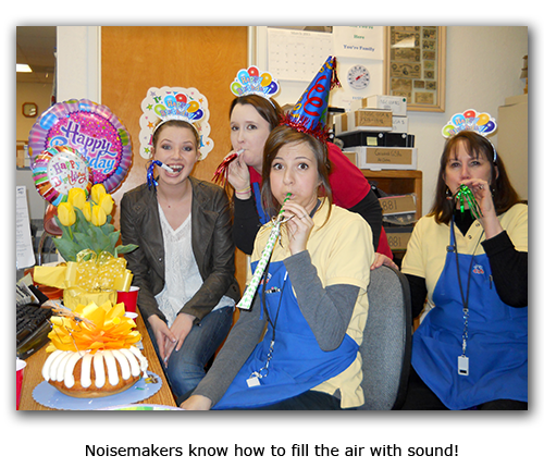 Southgate Coins owner Marie Goe makes some noise for Emily's birthday between appraising and selling cins