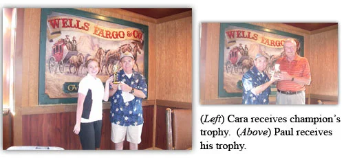 Cara and Paul receive their trophies for participation in the golf tournament