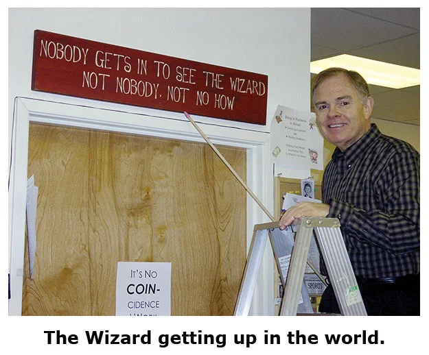 Southgate Coins owner Rusty Goe receives a sign the fits his personality