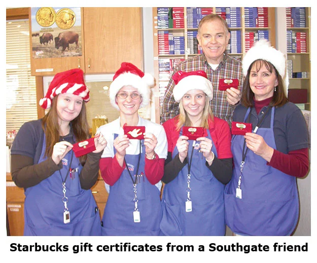 Southgate Coins staff receives a Starbucks gift card from a friend of the store