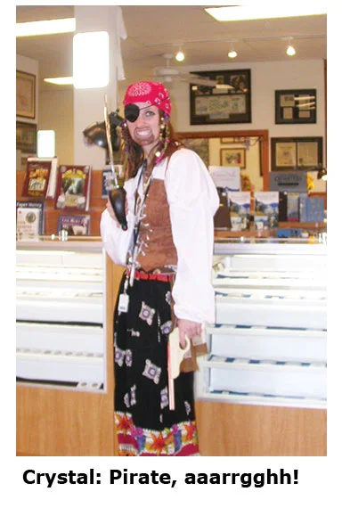 Crystal becomes a pirate at the coin shop’s Halloween dress up day