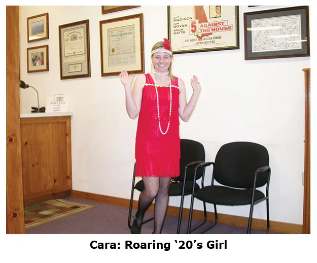 Cara’s a roaring 20s flapper at the coin shops Halloween dress up day
